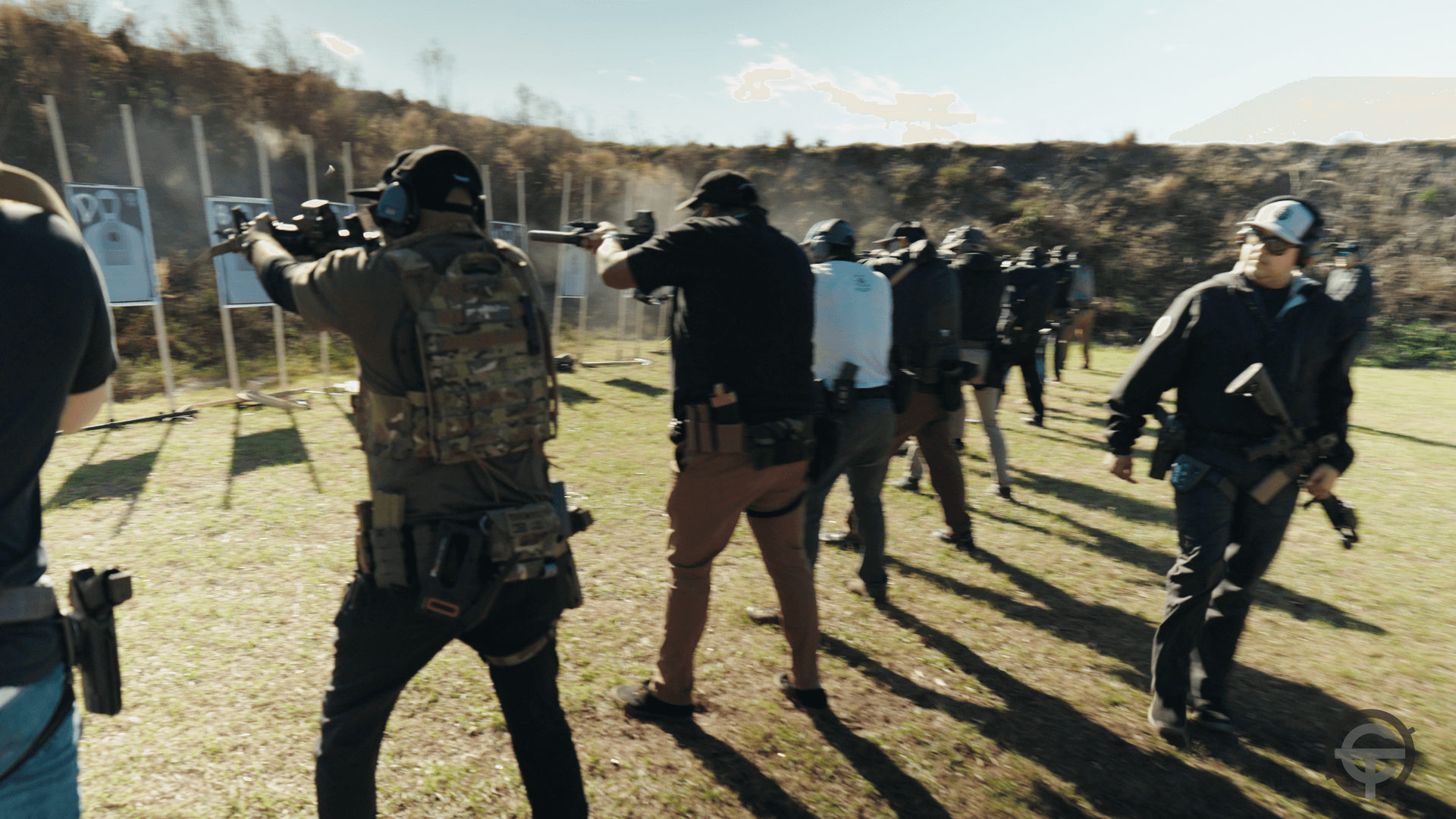 Group rifle class with students engaging silhouette targets at CTS range