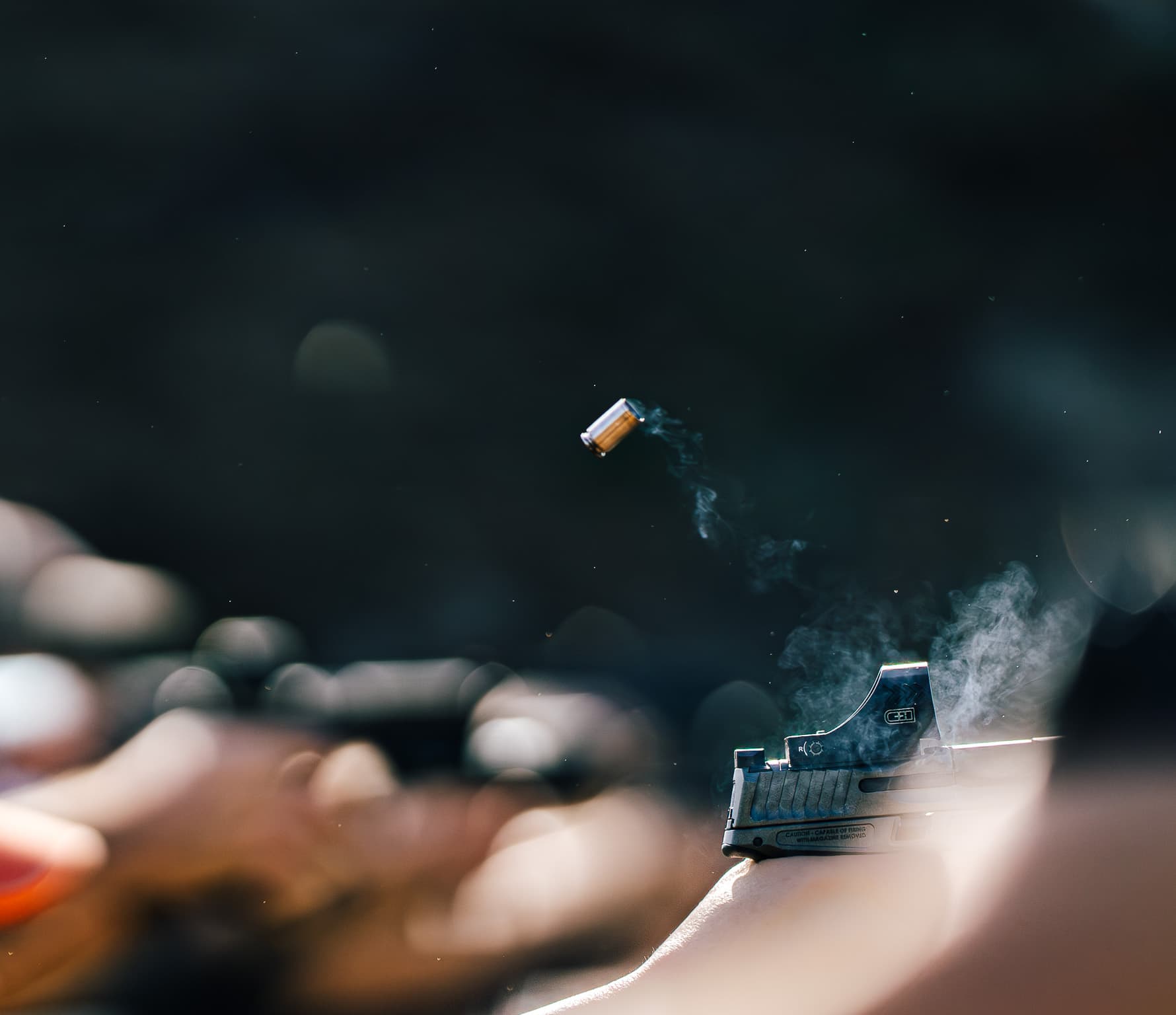 Shell ejection mid-flight during live fire pistol drill