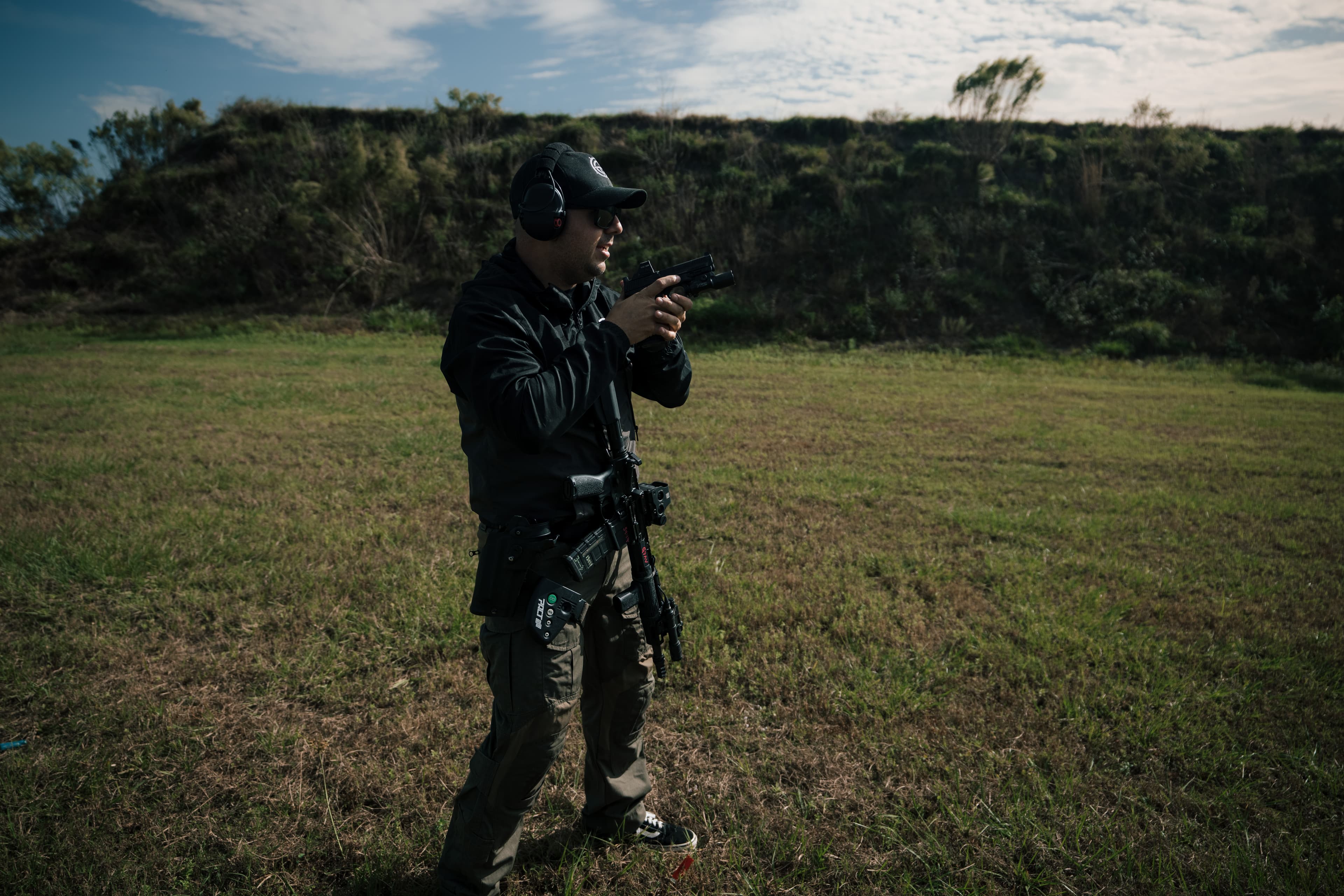 Josiah Smith checking equipment between drills on the range