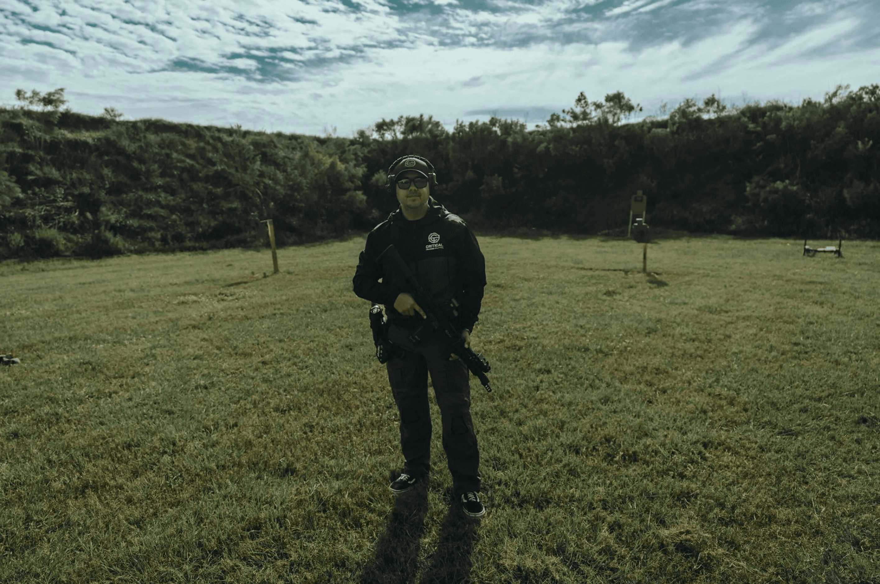 Josiah Smith - CTS Lead Instructor standing on range in tactical gear
