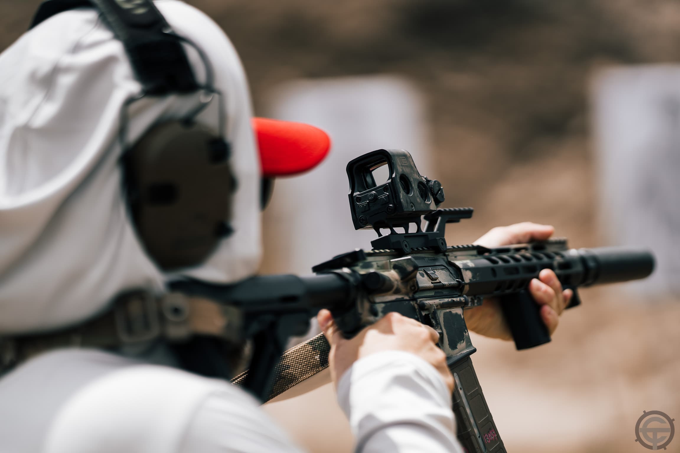 Close-up of AR platform with EOTech holographic sight during precision marksmanship drill